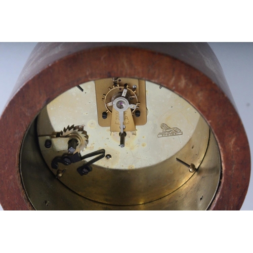 1192 - A SMALL EDWARDIAN MAHOGANY INLAID BALLOON SHAPED CLOCK on four brass ball feet. 8.5ins high.