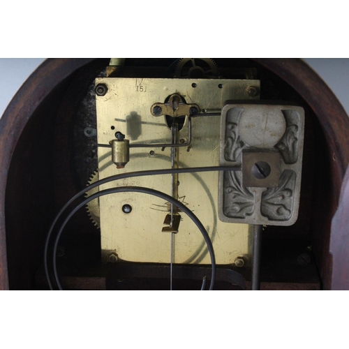 1193 - A 1930'S-1940'S MAHOGANY MANTLE CLOCK, with silvered dial on four bun feet. 11ins high.