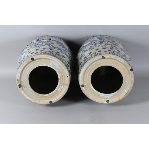 1326 - A PAIR OF CHINESE BLUE AND WHITE BARREL SEATS. 18ns high.