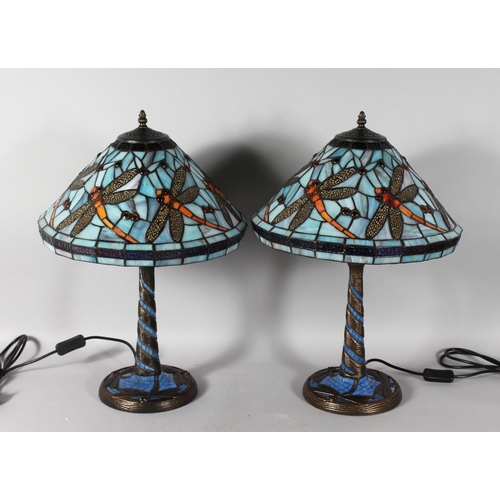 1329 - A GOOD PAIR OF TIFFANY DESIGN BLUE DRAGONFLY LAMPS. 22ins high.