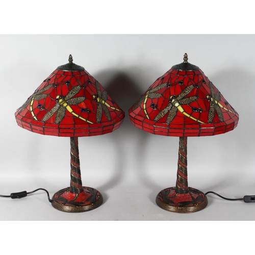 1330 - A GOOD PAIR OF TIFFANY DESIGN RED DRAGONFLY LAMPS. 22ins high.