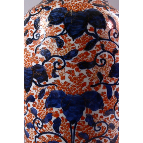 10 - A JAPANESE MEIJI PERIOD IMARI PORCELAIN VASE, decorated with scrolling native flora in typical imari... 