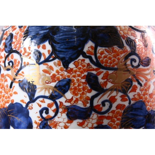 10 - A JAPANESE MEIJI PERIOD IMARI PORCELAIN VASE, decorated with scrolling native flora in typical imari... 