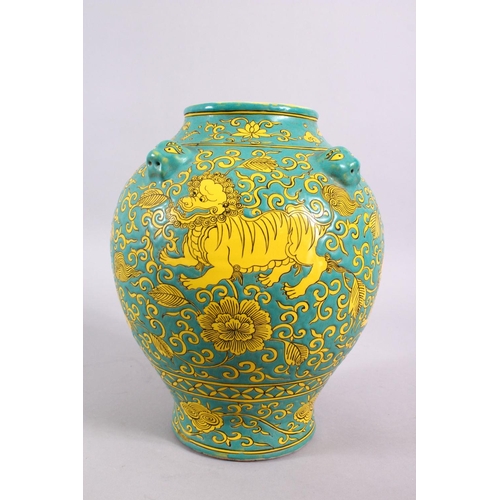 100 - A CHINESE MING STYLE TURQUOISE GROUND PORCELAIN KYLIN VASE, decorated with a turquoise ground with y... 