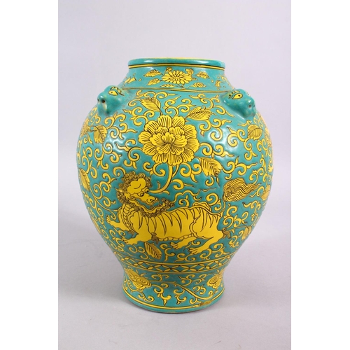 100 - A CHINESE MING STYLE TURQUOISE GROUND PORCELAIN KYLIN VASE, decorated with a turquoise ground with y... 