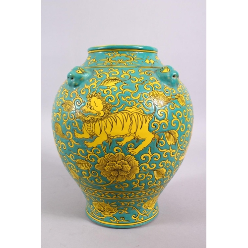 100 - A CHINESE MING STYLE TURQUOISE GROUND PORCELAIN KYLIN VASE, decorated with a turquoise ground with y... 