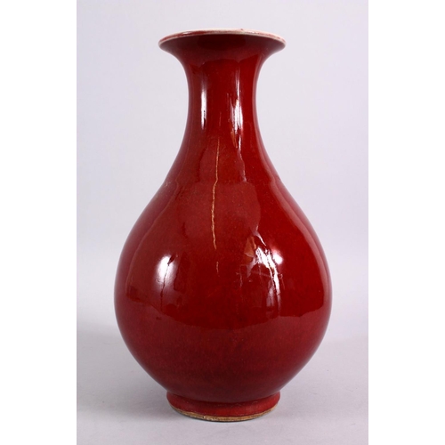 105 - A CHINESE OX BLOOD RED YUHUCHUNPIN PORCELAIN VASE, with a ox blood red ground and a flared rim, the ... 