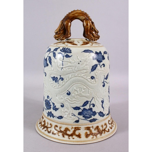 108 - A CHINESE BLUE, WHITE & BISCUIT MING STYLE DRAGON PORCELAIN TEMPLE BELL, the body with moulded relie... 