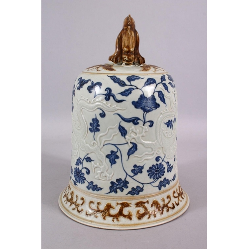 108 - A CHINESE BLUE, WHITE & BISCUIT MING STYLE DRAGON PORCELAIN TEMPLE BELL, the body with moulded relie... 