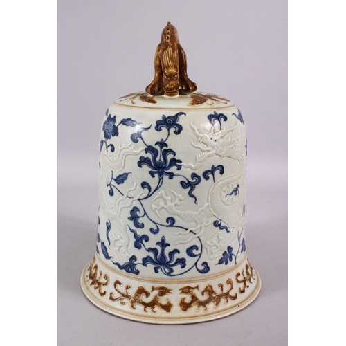 108 - A CHINESE BLUE, WHITE & BISCUIT MING STYLE DRAGON PORCELAIN TEMPLE BELL, the body with moulded relie... 