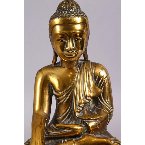 112 - A GOOD 19TH CENTURY SINO TIBETAN BRONZE SEATED BUDDHA, in a seated meditation position with his legs... 