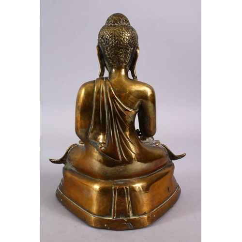 112 - A GOOD 19TH CENTURY SINO TIBETAN BRONZE SEATED BUDDHA, in a seated meditation position with his legs... 