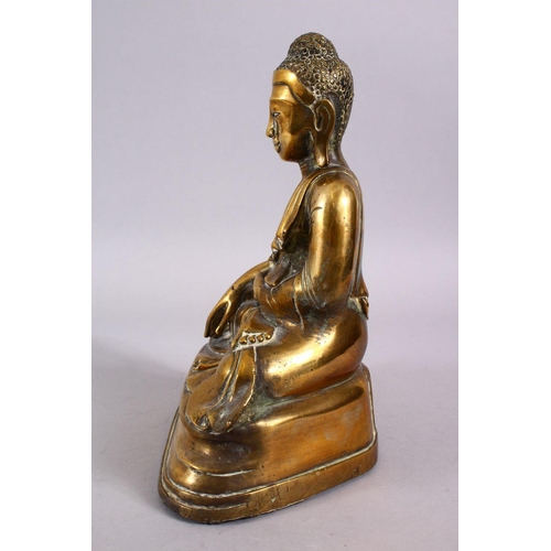 112 - A GOOD 19TH CENTURY SINO TIBETAN BRONZE SEATED BUDDHA, in a seated meditation position with his legs... 