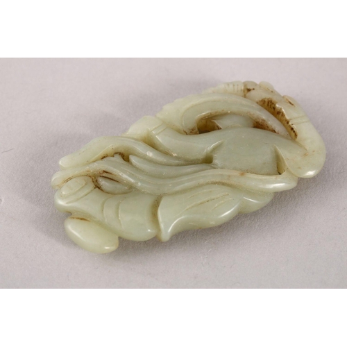 114 - A GOOD 19TH / 20TH CENTURY CHINESE CARVED CELADON JADE PENDANT OF A GODDESS, the goddess recumbent a... 