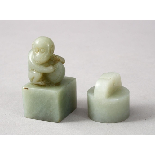 118 - TWO GOOD CHINESE CARVED JADE SEALS, one depicting a monkey crouched amongst his nut, the base carved... 