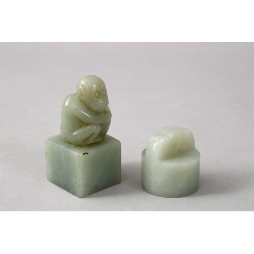 118 - TWO GOOD CHINESE CARVED JADE SEALS, one depicting a monkey crouched amongst his nut, the base carved... 