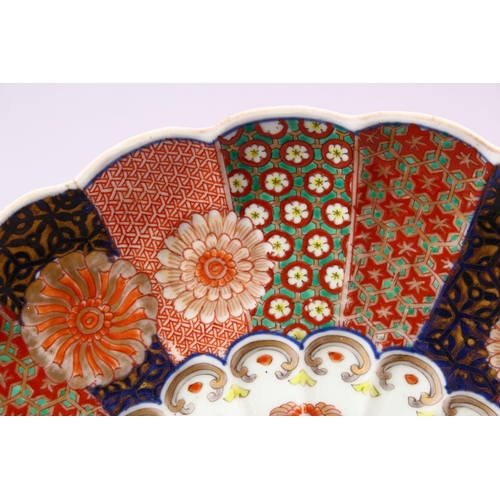 12 - A PAIR OF JAPANESE MEIJI PERIOD IMARI PORCELAIN CHRYSANTHEMUM FORMED PLATES, each decorated with flo... 