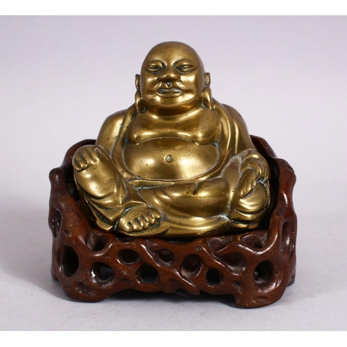 123 - A 19TH CENTURY CHINESE BRONZE FIGURE OF BUDDHA & STAND, seated with his hand upon his knee, in a car... 