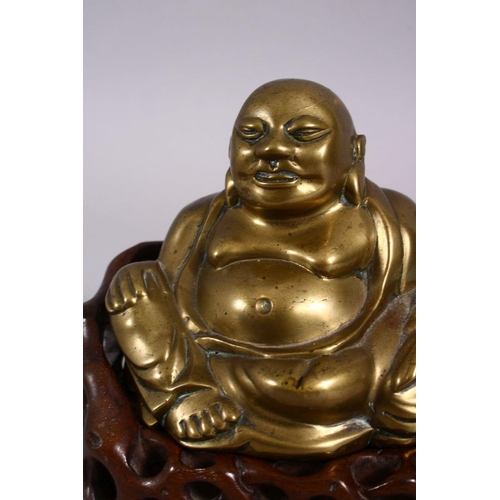 123 - A 19TH CENTURY CHINESE BRONZE FIGURE OF BUDDHA & STAND, seated with his hand upon his knee, in a car... 