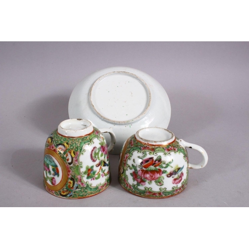 124 - A 19TH CENTURY CHINESE FAMILLE ROSE CANTON CUPS & SAUCER, decorated with panels of birds and flora &... 