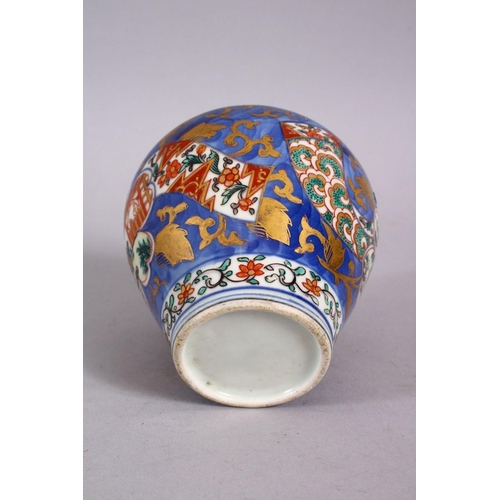 126 - AN 18TH CENTURY JAPANESE BLUE, WHITE AND IRON RED PORCELAIN ARITA JAR & COVER, with landscape views ... 