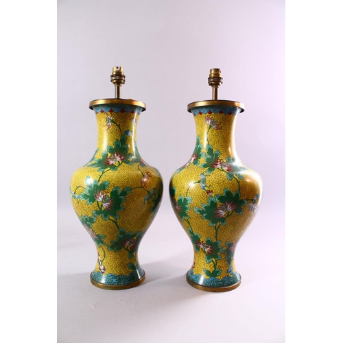 130 - A PAIR OF CHINESE CLOISONNE VASES, with yellow ground and lotus flowers, converted into lamps, 47cm ... 