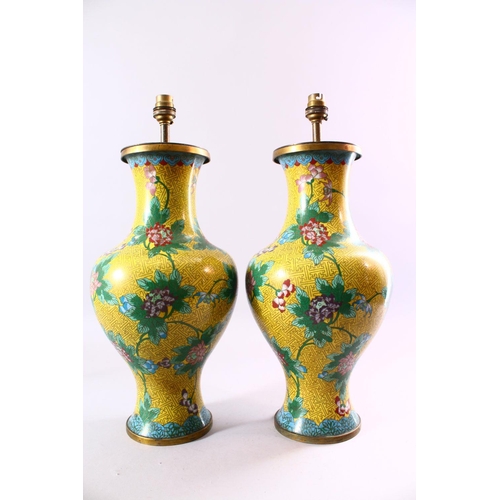 130 - A PAIR OF CHINESE CLOISONNE VASES, with yellow ground and lotus flowers, converted into lamps, 47cm ... 