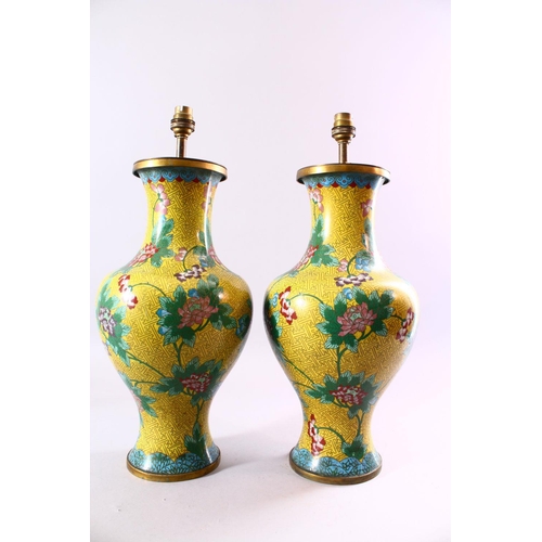 130 - A PAIR OF CHINESE CLOISONNE VASES, with yellow ground and lotus flowers, converted into lamps, 47cm ... 