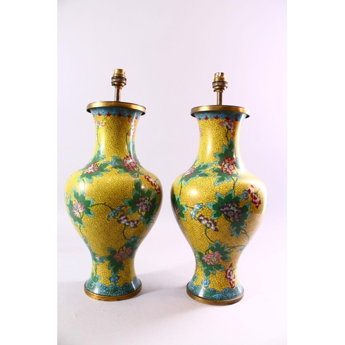 130 - A PAIR OF CHINESE CLOISONNE VASES, with yellow ground and lotus flowers, converted into lamps, 47cm ... 