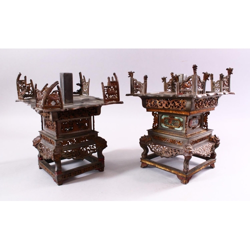 136 - A MATCHED PAIR OF 19TH CENTURY CHINESE SPELTER PAGODA FORM CANDLE STANDS, with cast and pierced deco... 