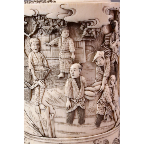 139 - AN EARLY 20TH CENTURY JAPANESE CARVED IVORY TUSK VASE AND COVER, the exterior carved with numerous f... 