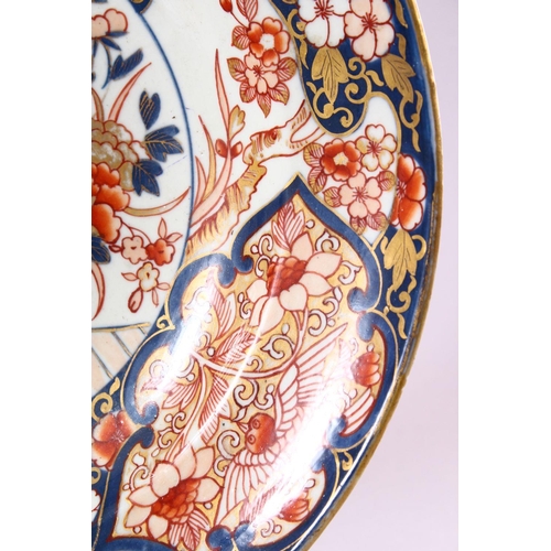 14 - A JAPANESE EDO / MEIJI PERIOD IMARI PORCELAIN CHARGER, decorated with scenes of ikebana displays wit... 