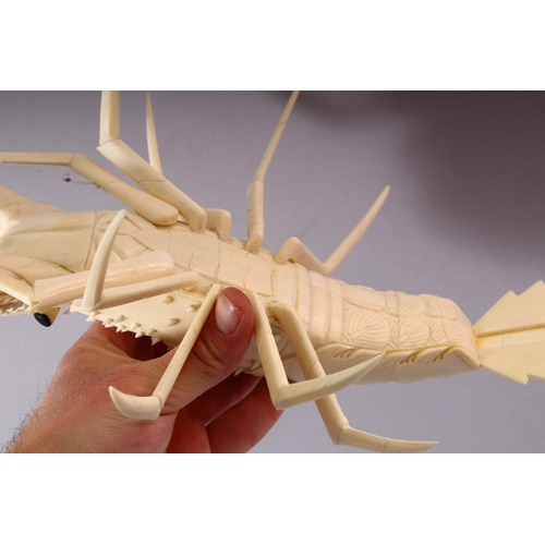 147 - A PAIR OF JAPANESE 20TH CENTURY CARVED BONE MODELS OF CRAYFISH, 30cm long.