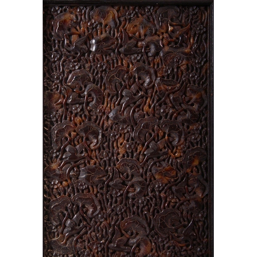 148 - A FINE 19TH CENTURY JAPANESE TORTOISESHELL PANEL, carved with birds and lotus leaves, mounted in a h... 