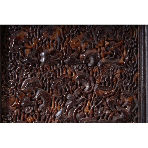 148 - A FINE 19TH CENTURY JAPANESE TORTOISESHELL PANEL, carved with birds and lotus leaves, mounted in a h... 