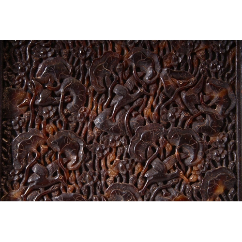 148 - A FINE 19TH CENTURY JAPANESE TORTOISESHELL PANEL, carved with birds and lotus leaves, mounted in a h... 