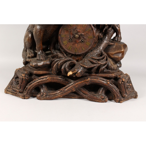 1195A - A VERY GOOD ANTIQUE BLACK FOREST CLOCK CARVED WITH TWO SAINT BERNARD DOGS, one with a bell around hi... 