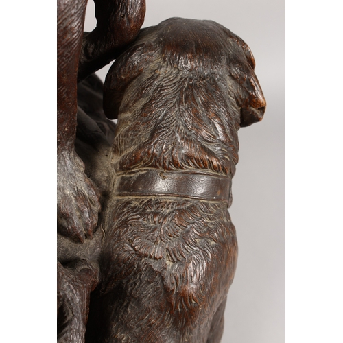 1195A - A VERY GOOD ANTIQUE BLACK FOREST CLOCK CARVED WITH TWO SAINT BERNARD DOGS, one with a bell around hi... 