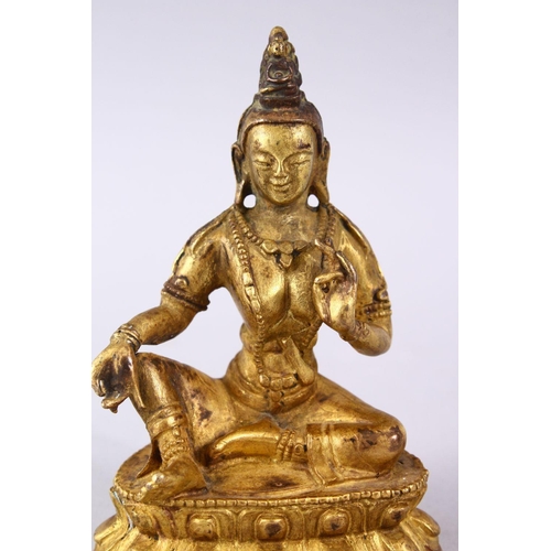 155 - A GOOD CHINESE QING DYNASTY GILT BRONZE FIGURE OF BUDDHA, in a seated position upon a lotus form bas... 