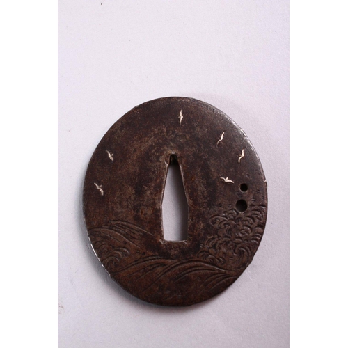 158 - TWO 19TH CENTURY JAPANESE CAST IRON TSUBA, each with engraved and inlaid decoration, 7cm and 7.5cm.