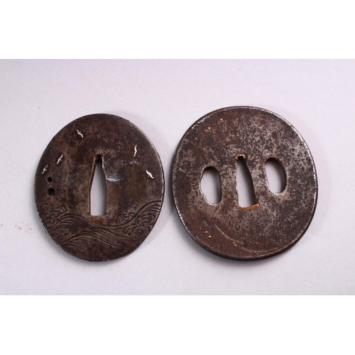 158 - TWO 19TH CENTURY JAPANESE CAST IRON TSUBA, each with engraved and inlaid decoration, 7cm and 7.5cm.