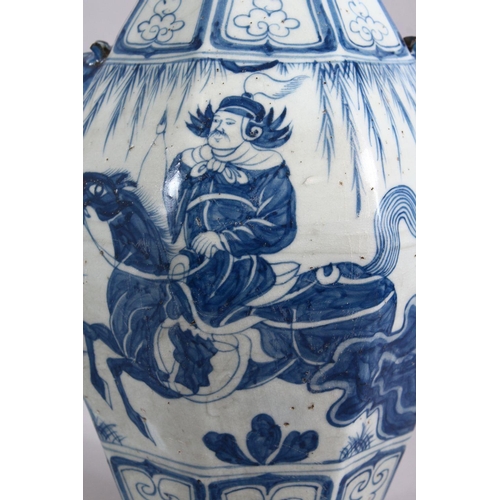 160 - A CHINESE YAN STYLE BLUE & WHITE TWIN HANDLE PORCELAIN VASE, decorated with scenes of a warrior upon... 