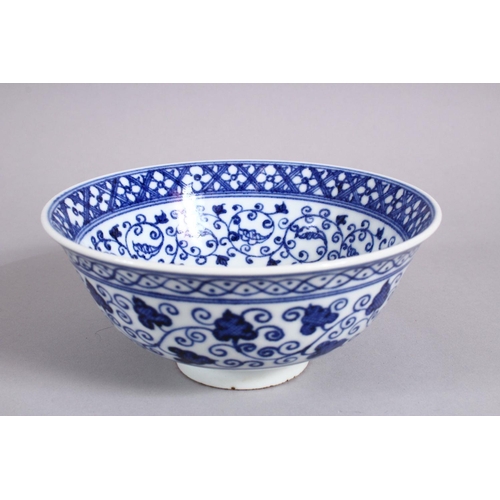 162 - A CHINESE BLUE & WHITE MING STYLE PORCELAIN BOWL, with a central display of lotus, with surrounding ... 