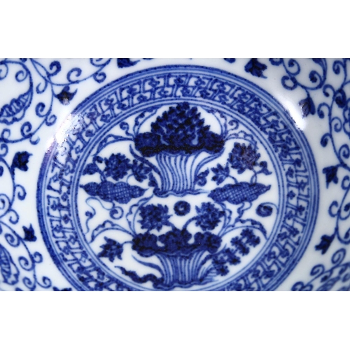 162 - A CHINESE BLUE & WHITE MING STYLE PORCELAIN BOWL, with a central display of lotus, with surrounding ... 