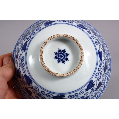 162 - A CHINESE BLUE & WHITE MING STYLE PORCELAIN BOWL, with a central display of lotus, with surrounding ... 