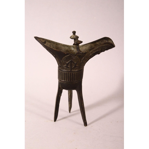 169 - A SMALL PAIR OF CHINESE ARCHAIC FORM CAST BRONZE TRIPOD CENSERS, 13cm.