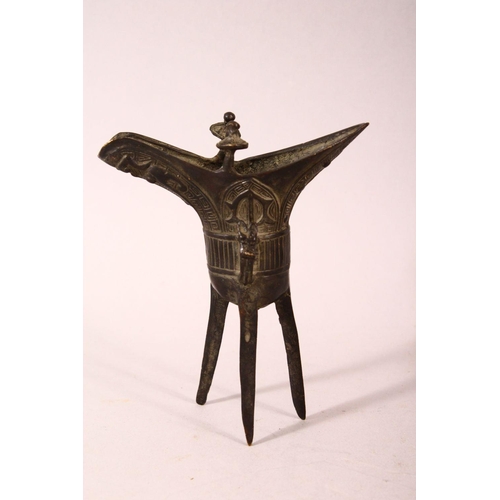 169 - A SMALL PAIR OF CHINESE ARCHAIC FORM CAST BRONZE TRIPOD CENSERS, 13cm.