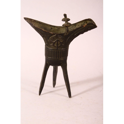 169 - A SMALL PAIR OF CHINESE ARCHAIC FORM CAST BRONZE TRIPOD CENSERS, 13cm.