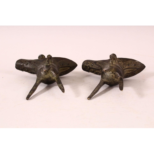 169 - A SMALL PAIR OF CHINESE ARCHAIC FORM CAST BRONZE TRIPOD CENSERS, 13cm.