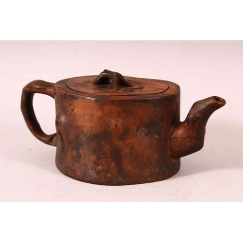 171 - A CHINESE YIXING TEAPOT, of naturalistic form, 20cm wide.